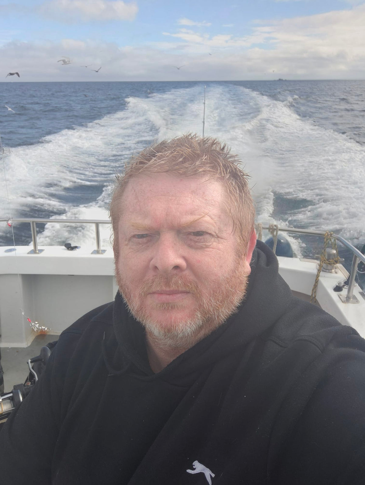 Mark, the maker behind CraftyDrifters Cornwall, on a boat at sea