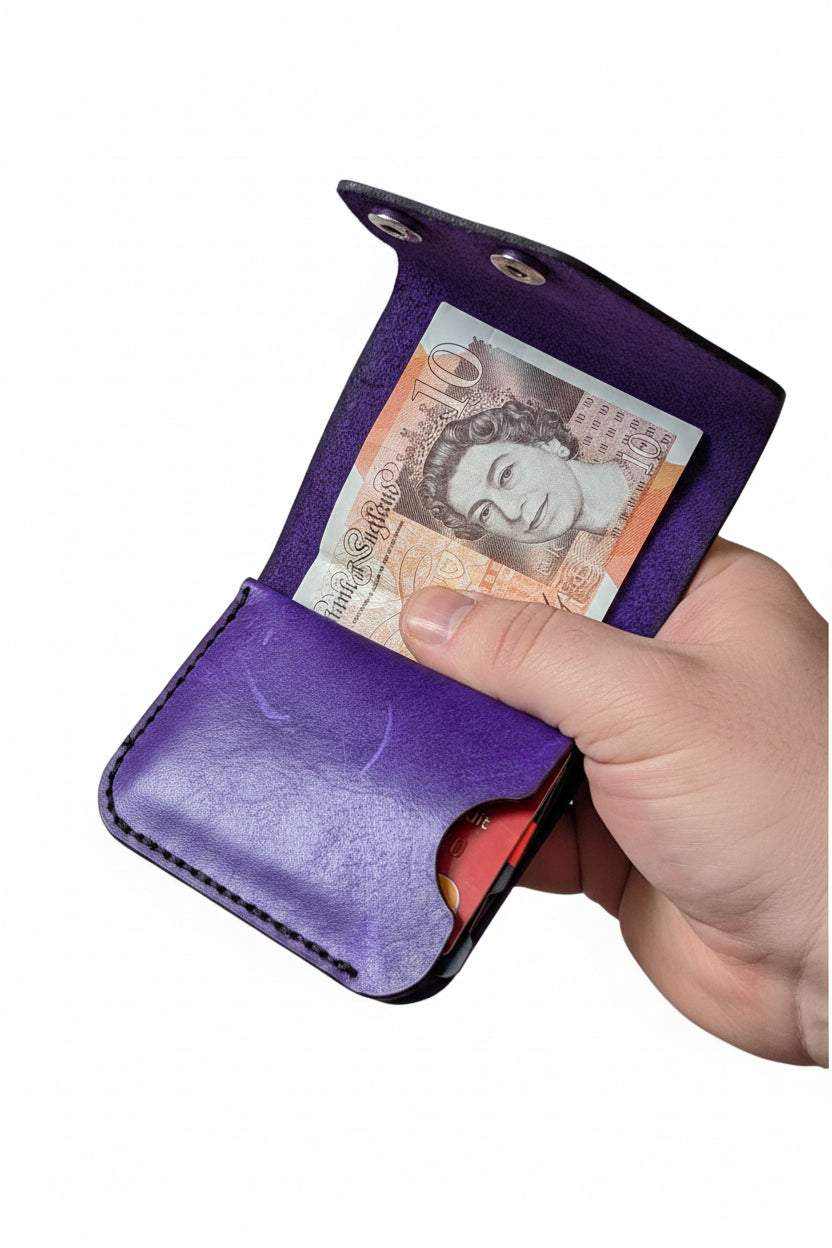compact club wallet holding cards and notes in full-grain leather