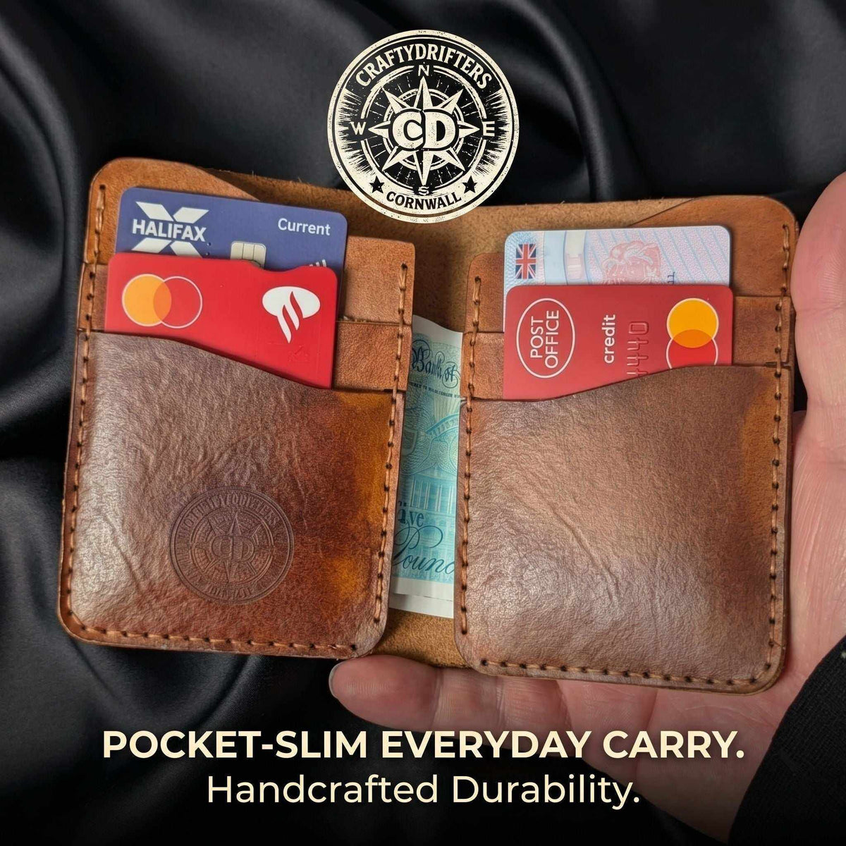 Handmade brown leather bifold wallet filled with credit cards and cash.