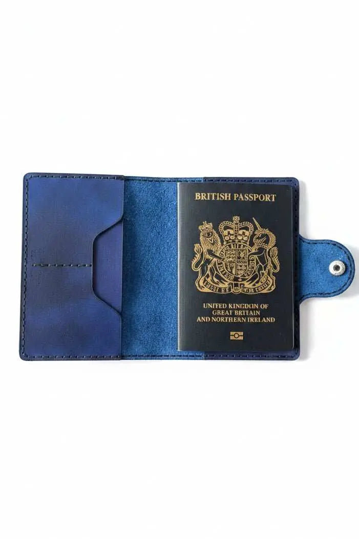 Handmade blue leather passport holder containing a British passport.