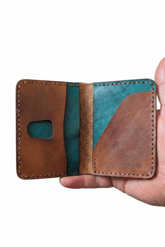 Low profile handmade bi-fold leather wallet crafted from full-grain leather