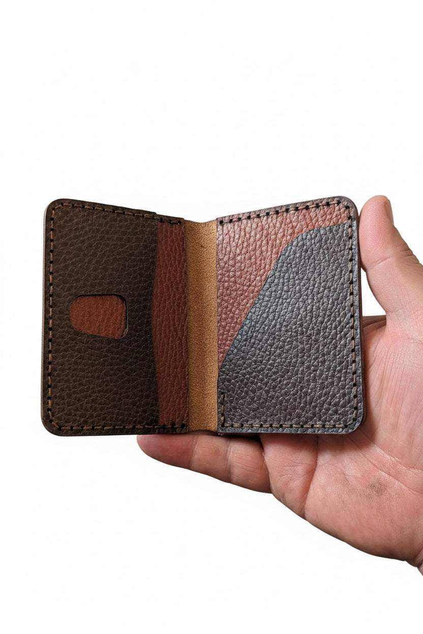 Devonport Low Profile leather bi-fold held open, multi-tone brown and burgundy leather