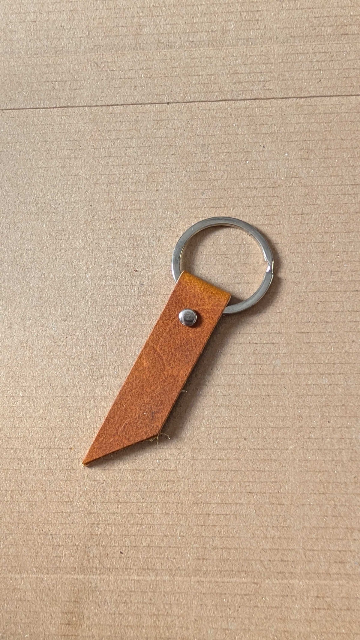 Tan leather keyring fob with angled tip and split ring, handmade in Cornwall