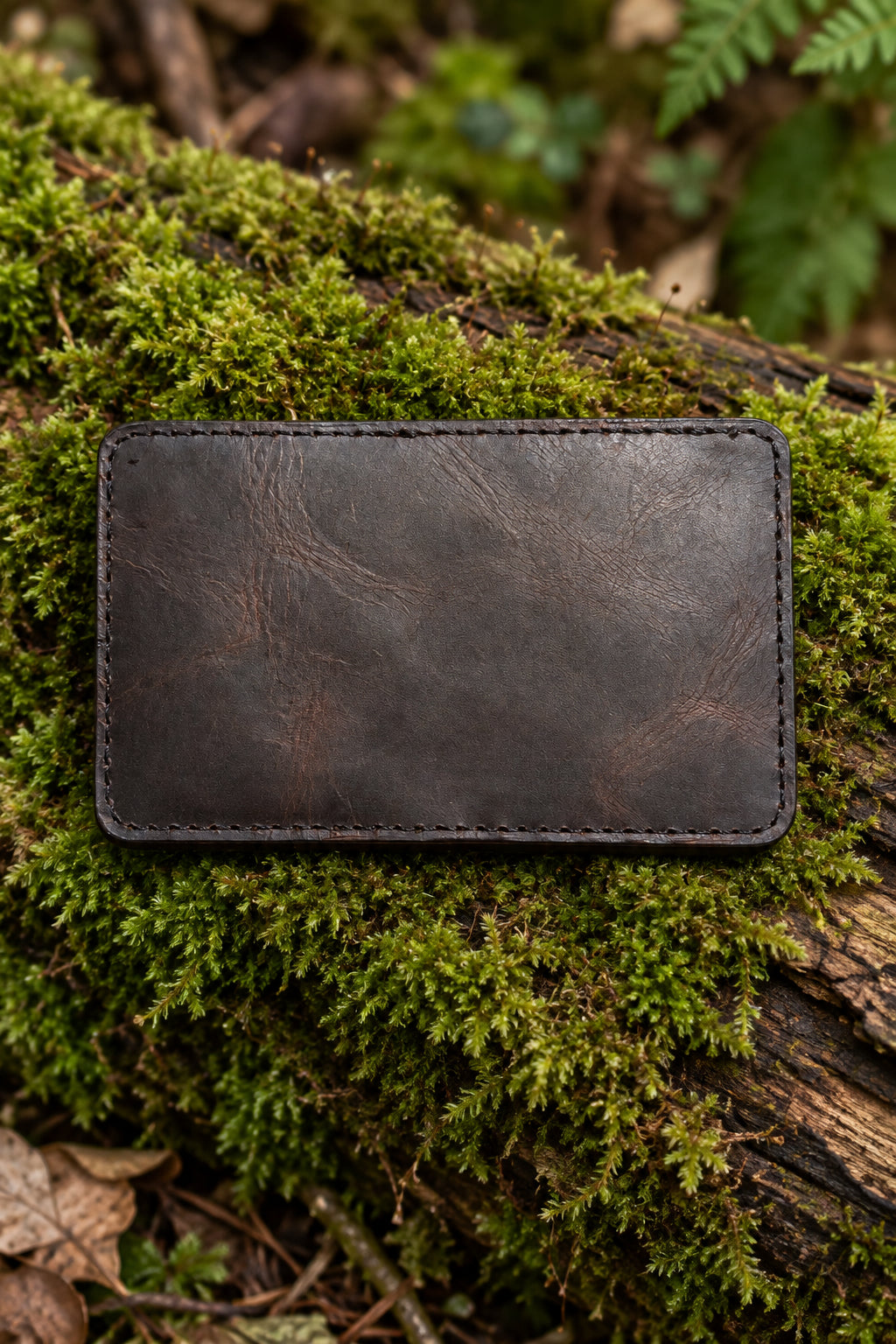 Slim Premium Badalassi leather bi-fold wallet closed on moss, handmade in Cornwall