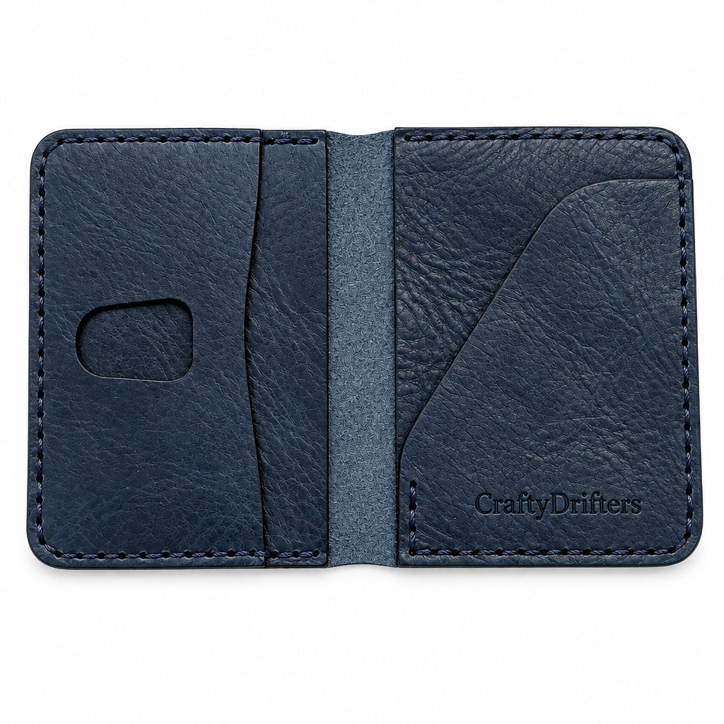 Devonport Premium bi-fold in navy Badalassi leather, open on a white background