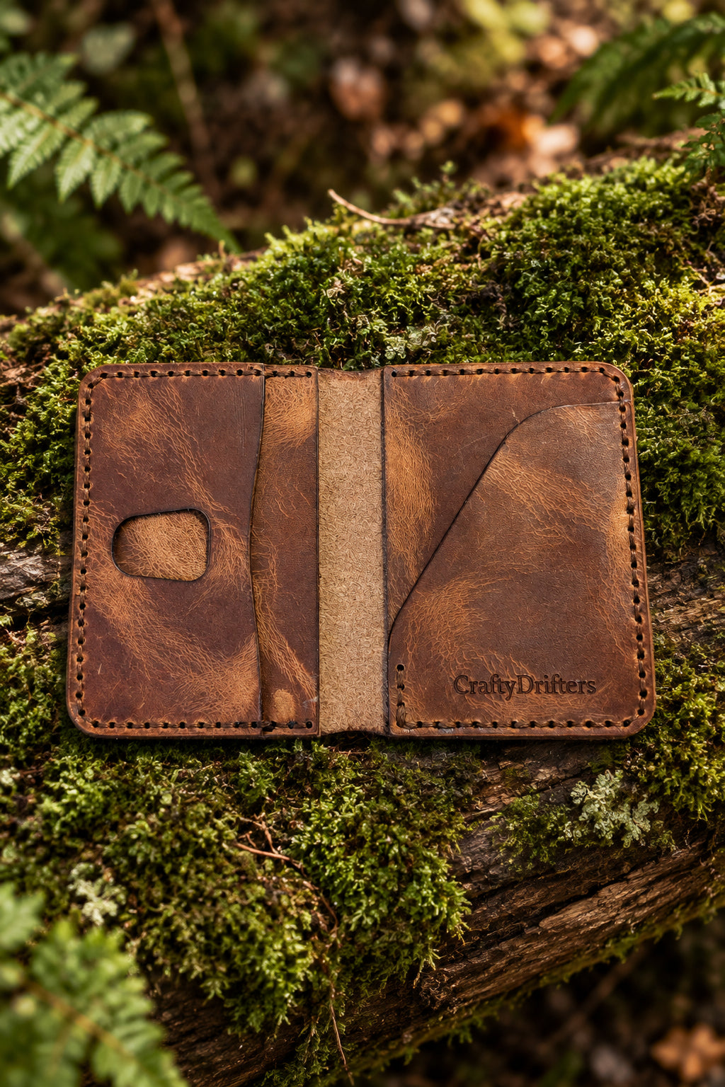 Devonport Premium tan Badalassi leather bi-fold open on moss