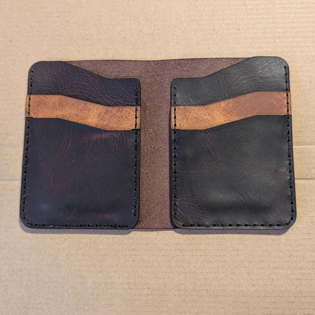 Hilldown Premium bi-fold open and empty, dark leather with tan pocket trim
