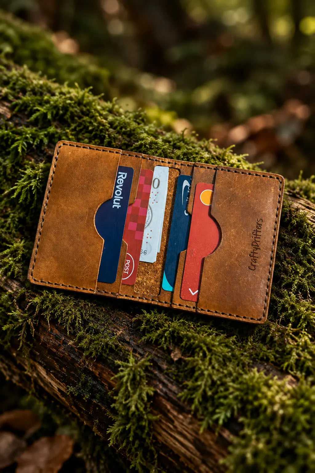 Style 6 leather bi-fold wallet open with bank cards in the six pockets