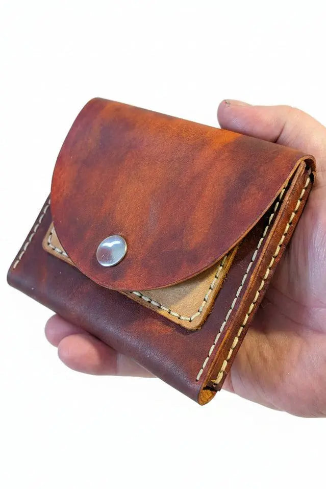 Handmade brown veg-tan leather coin purse with silver snap button closure