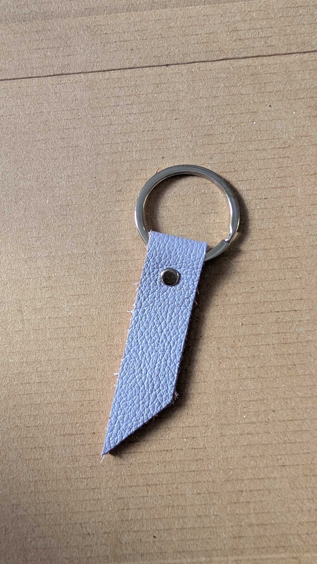 Light blue leather keyring fob with angled tip and split ring, handmade in Cornwall