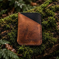 Two-tone Badalassi leather card wrap, handmade in Cornwall, on moss