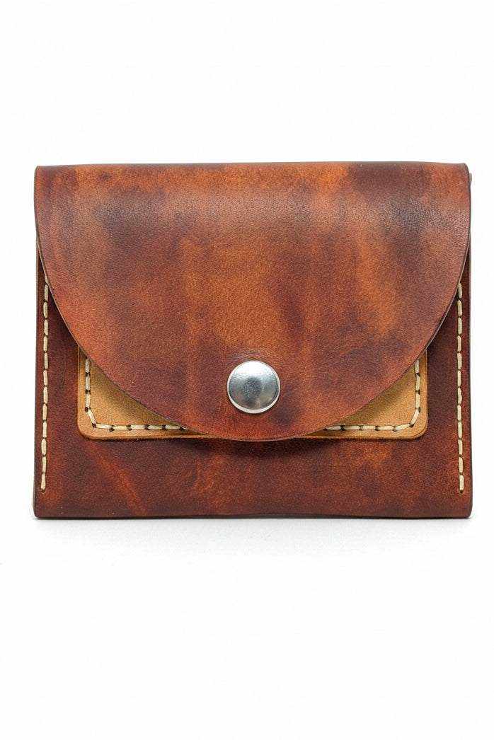 The Duporth mahogany leather coin purse closed with a silver snap