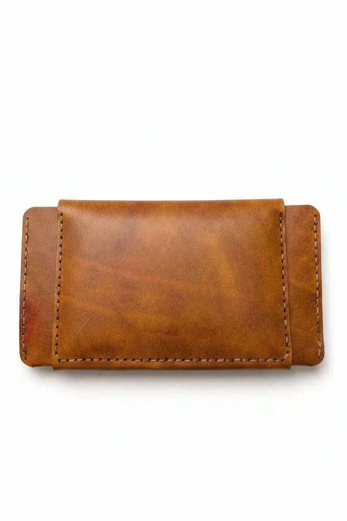 Trucker-style tan leather passport wallet closed, front view
